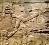 Рельеф гипостиля с изображением Сети I, жертвующего букет лотосов